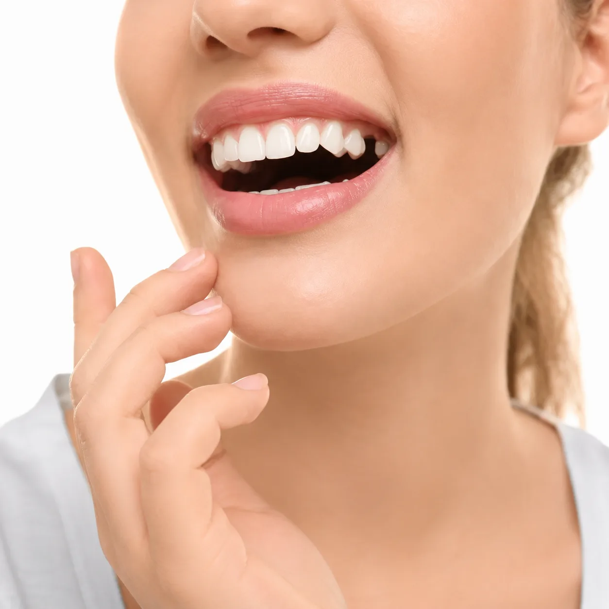 Dentist at Arasu Dental Care, Coimbatore, explaining tooth replacement options — implant, bridge and denture — to a patient