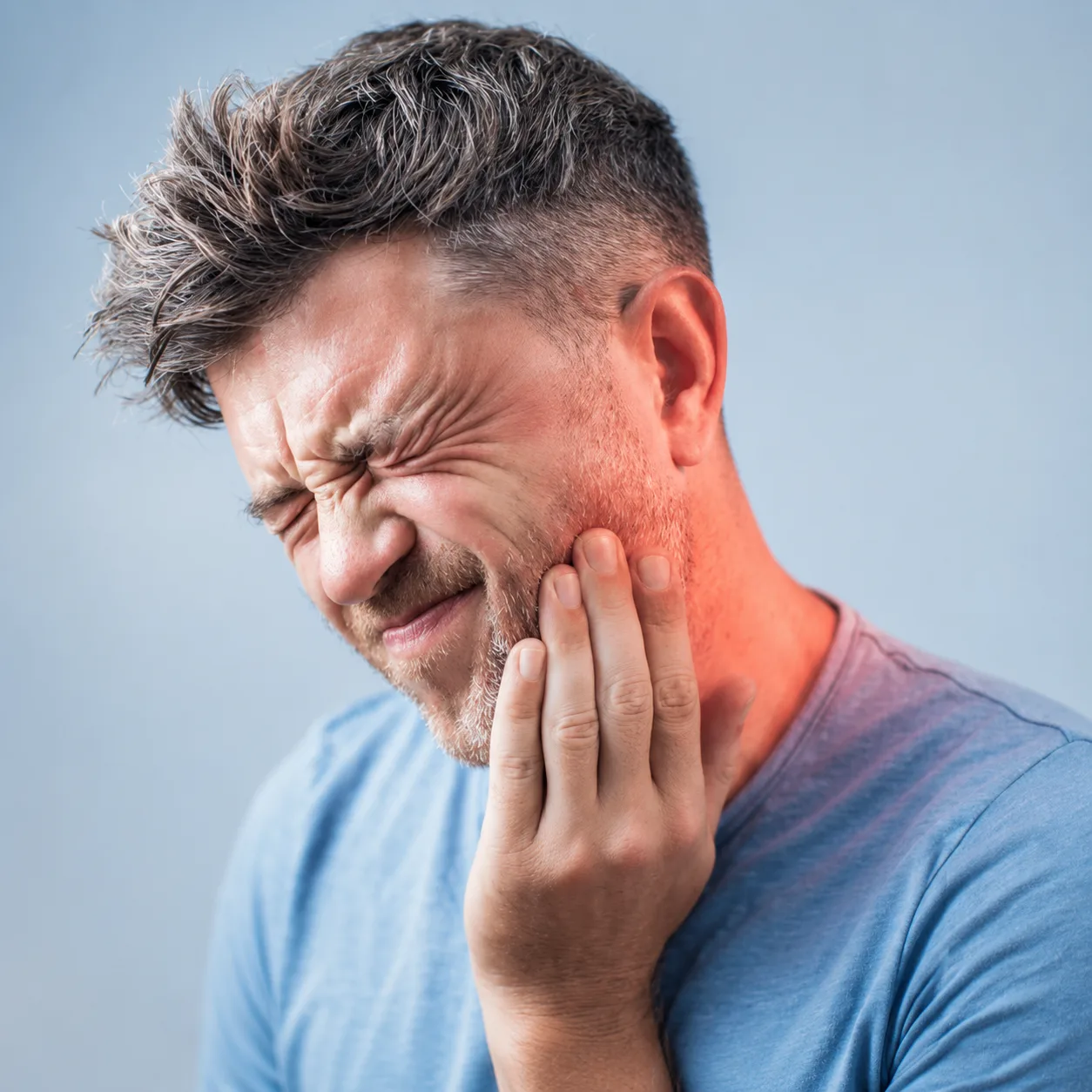 Dentist at Arasu Dental Care, Coimbatore, examining a patient with tooth pain to find the cause